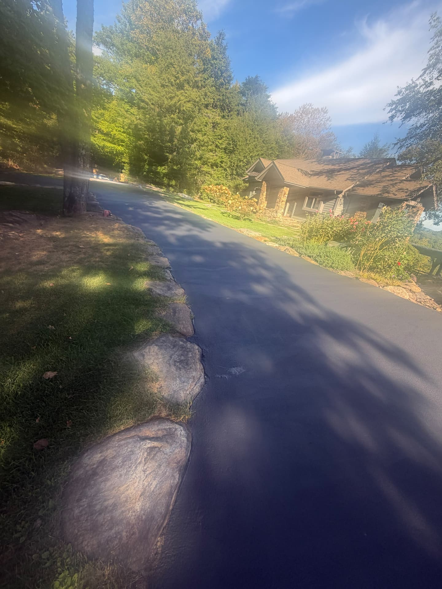 Mountain home driveway freshly sealcoated with a smooth even finish